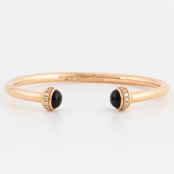 Piaget 18K rose gold, brilliant-cut diamonds and onyx cabochons.