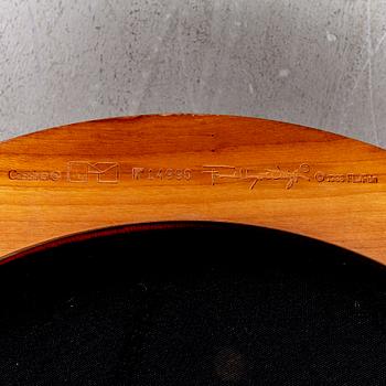 A cherry wood model 606 'Barrel' chair by Frank Lloyd Wright from Cassina.