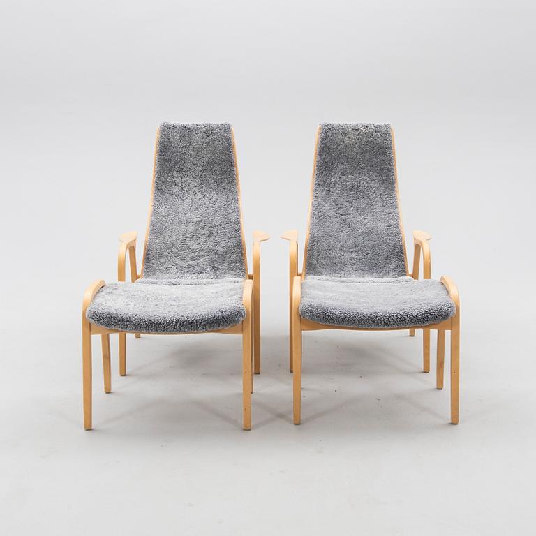 Yngve Ekström, armchair set with footstools, "Lamino", Swedese 2014.