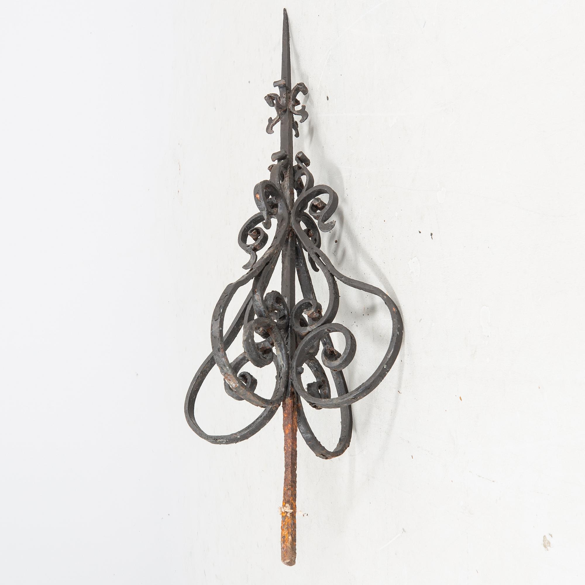 An around 1900s cast iron roof ornament.