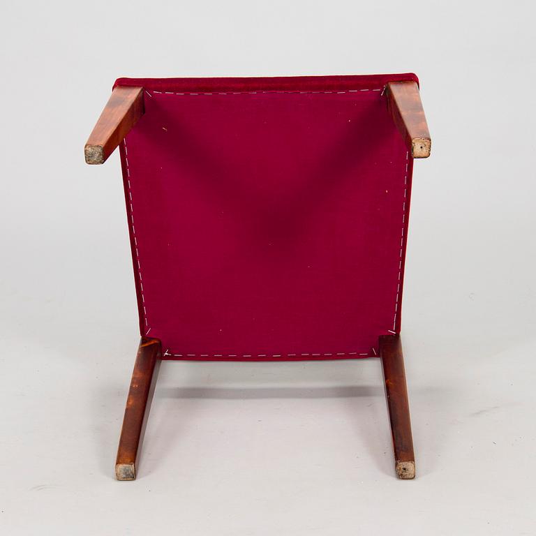 A mid 20th century dining table and a set of four chairs, Oy Boman Ab and two chairs Werner West.