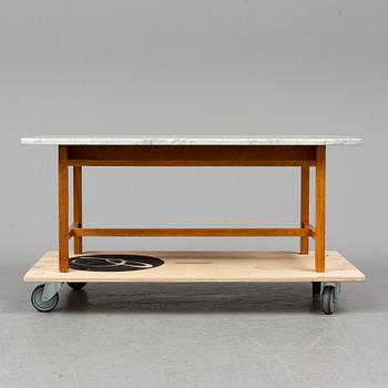 JOSEF FRANK, a model 2125 marble top coffee table from Svenskt Tenn.