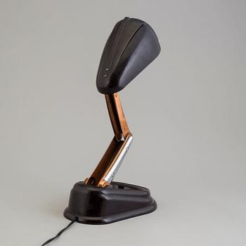 a bakelite and metal table 'Bolide' table lamp, by JUMO, 1940's.