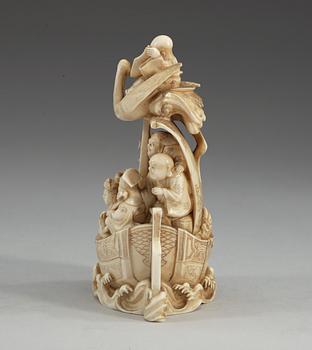 A carved sectional ivory group of Shou Lao with his crane and seven immortals in a boat, Qing dynasty, circa 1900, signed.