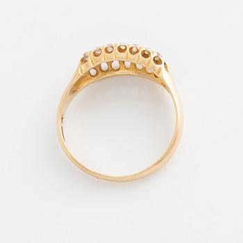 Ring in 18K gold with diamonds and blue stones.