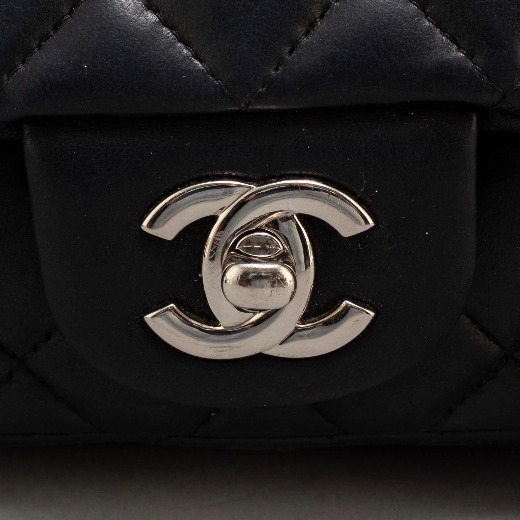 CHANEL, a black leather 'Extra mini flap bag' 2012-13.