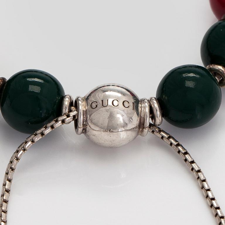 Gucci, a 'Boule Britt"' bracelet.