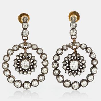 A pair of earrings set with old-cut diamonds with a total weight of ca 2.80 cts.