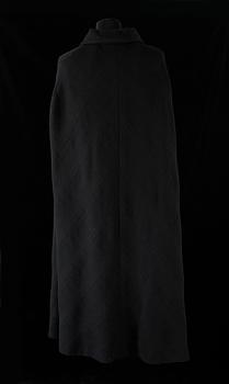 A black 1960s/70s cape by Hermès.
