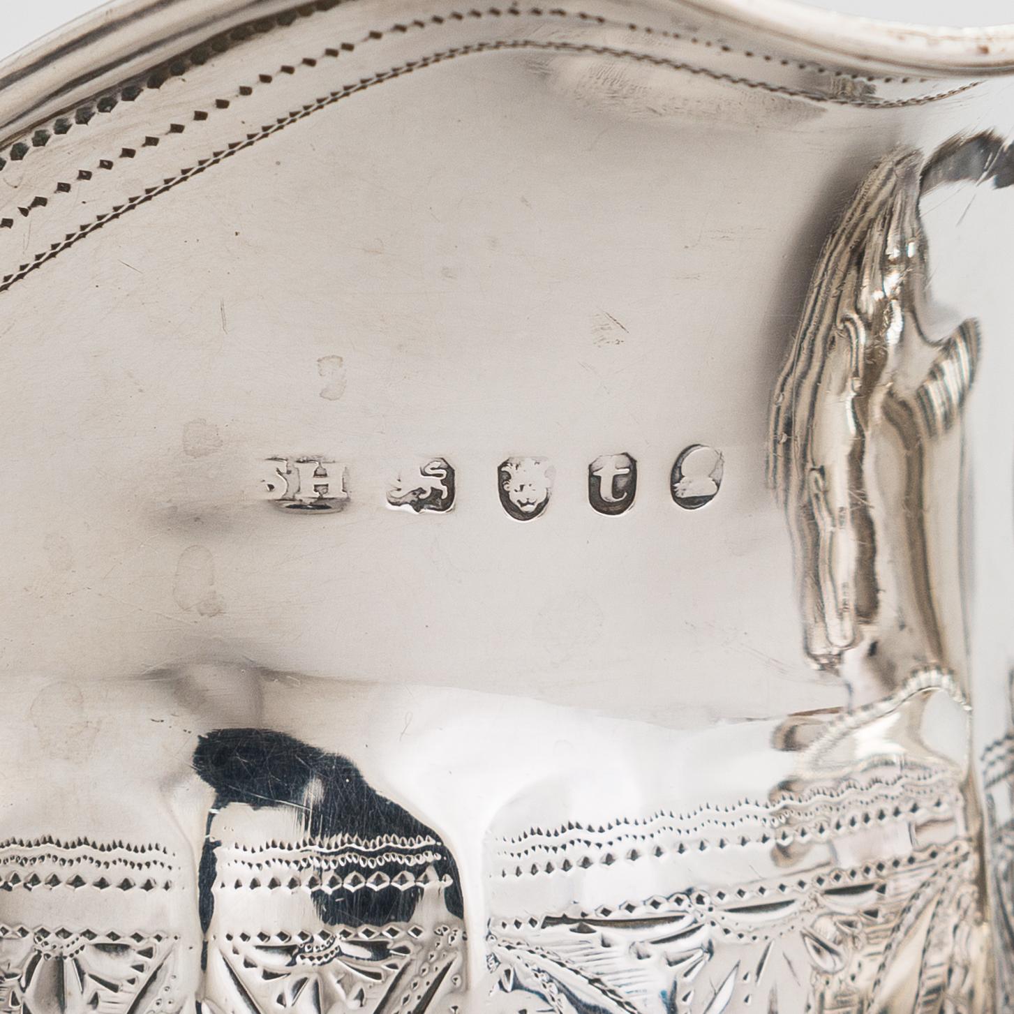 Two sterling silver milk jugs, London 1794 och 1828.