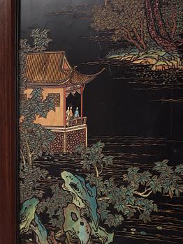 A set of four Chinese lacquer panels with wooden frames, early 20th century.