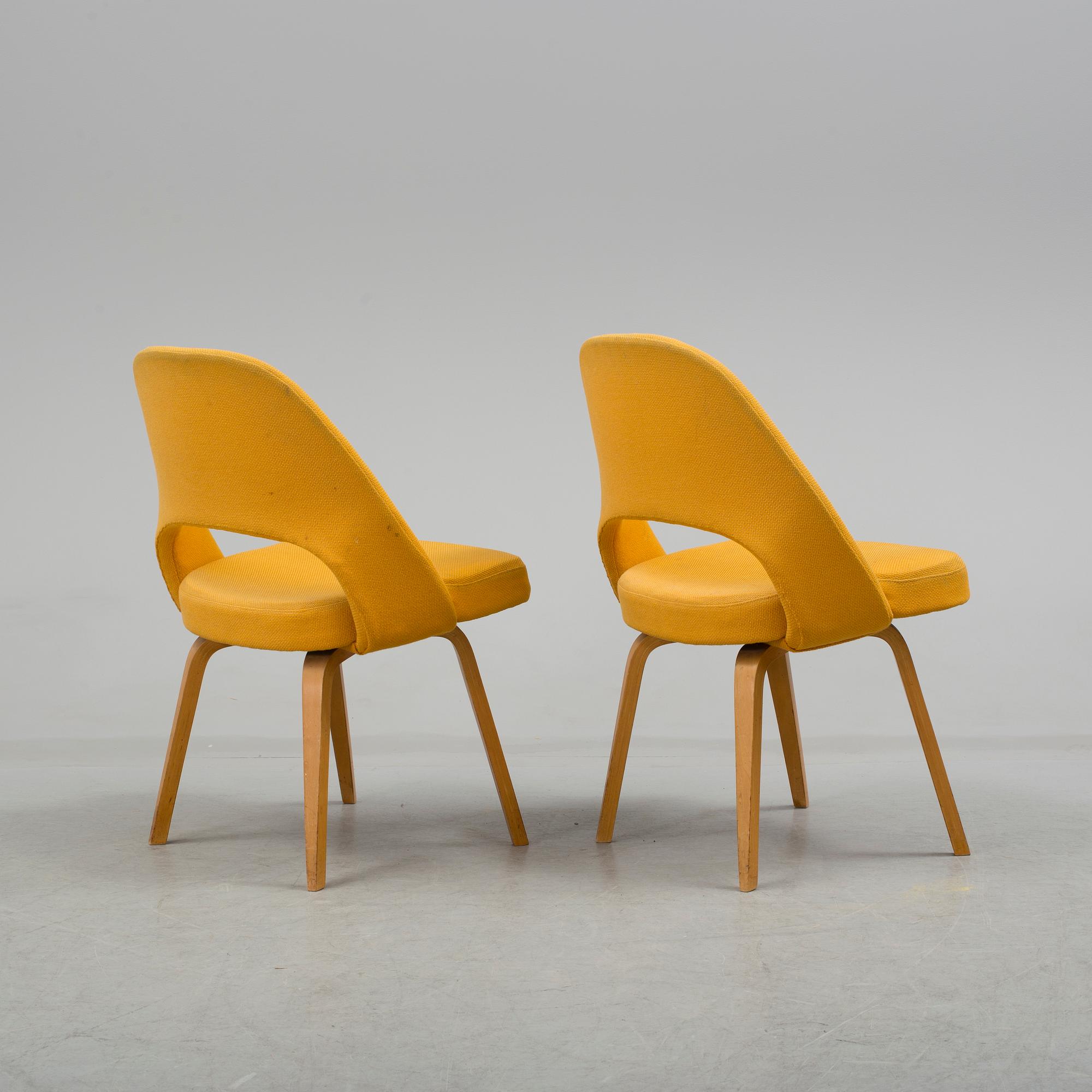 A group eight of Eero Saarinen executive side chair with wood legs, Knoll Products inc.