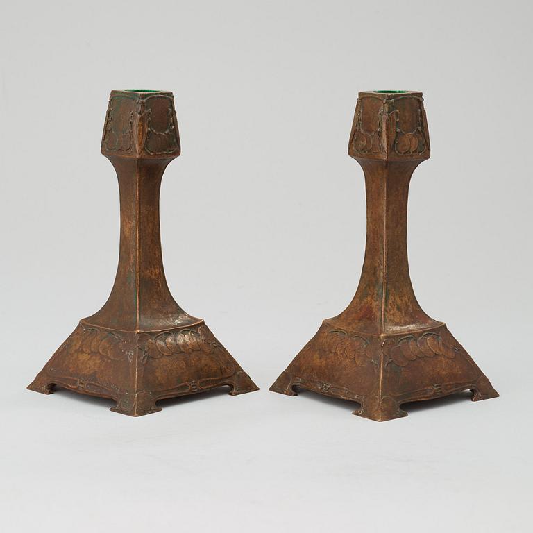 A pair of G Backlund & Hugo Elmqvist Art Nouveau patinated bronze candlesticks, AB Hugo Emlqvist, Stockholm.