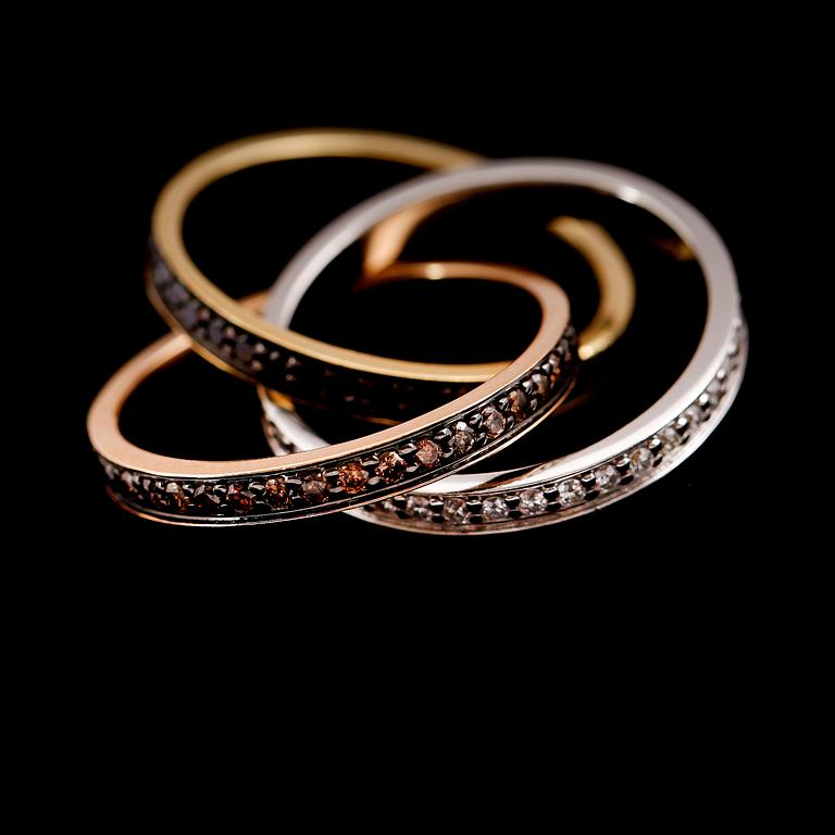 RING, tredelad, 18 k rött, vitt och roséguld, diamanter totalt 1.44 ct.