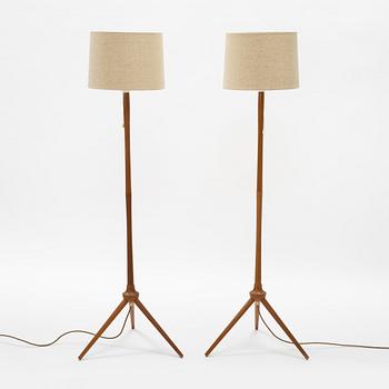 A pair of teak floor lamps, mid 20th century.
