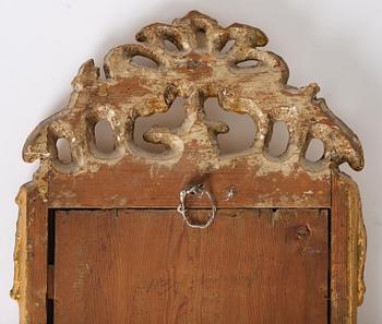 A rococo giltwood mirror by N. Meunier (master i Stockholm 1754-97).