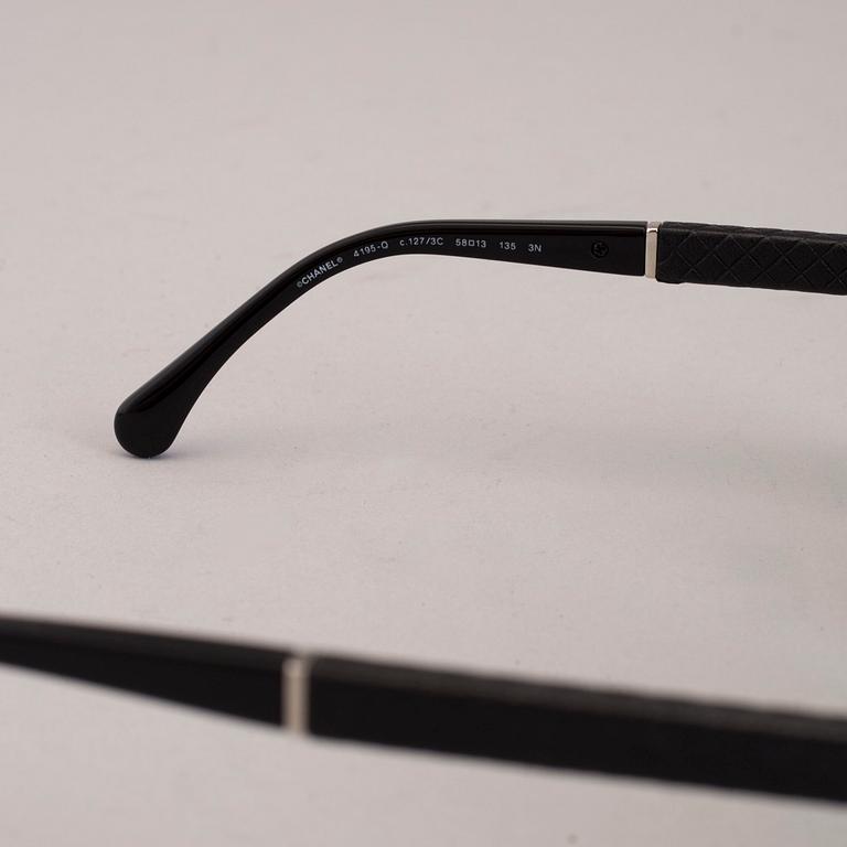 Chanel black pilot summer glasses.