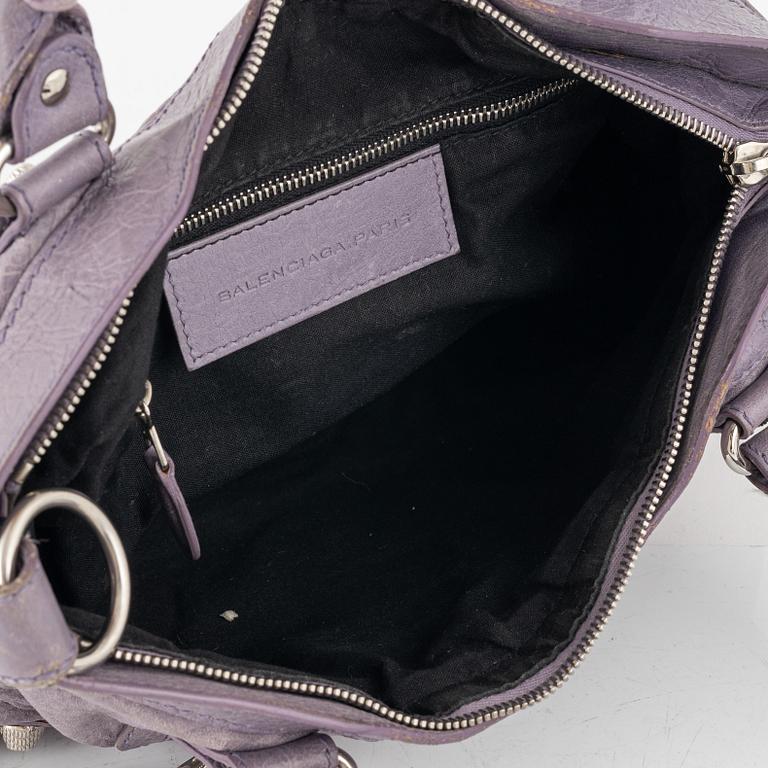 Balenciaga, a purple leather 'City' handbag.