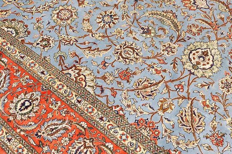 A Ghom carpet, part silk, approx. 480 x 350 cm.