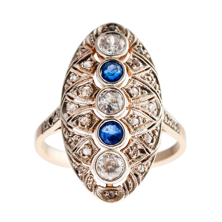 A RING, 14K gold, old- and rose cut diamonds c. 0,75 ct, sapphires. Size 17,5. Weight 5 g.