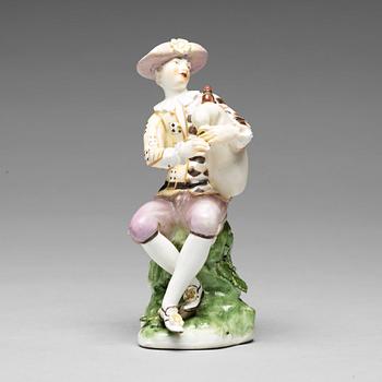 248. A porcelain figure of a bagpiper, 'Meissen mark'.