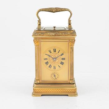 A French Brass and Glass Aiguilles Carriage Clock with Leather Case, first half of the 20th century.