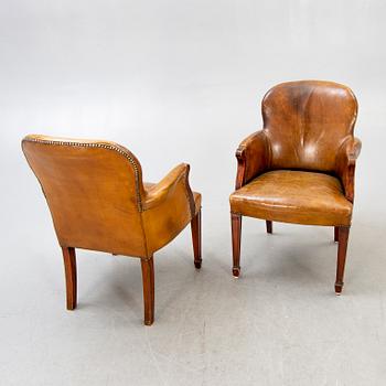 Fritz Henningsen, a pair of mahogany and leather armchairs Denmark mid 1900s.