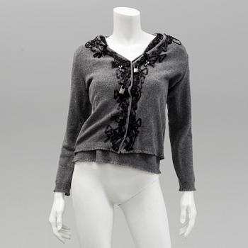 Cardigan and top by Moschino, Cheap and Chic.