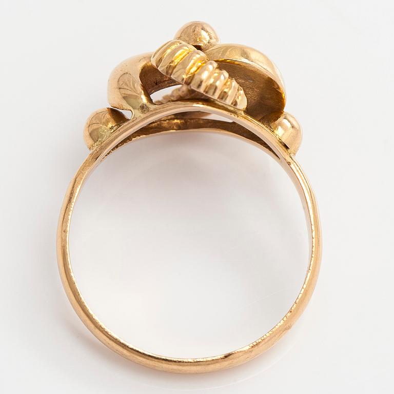 A 14K gold ring.