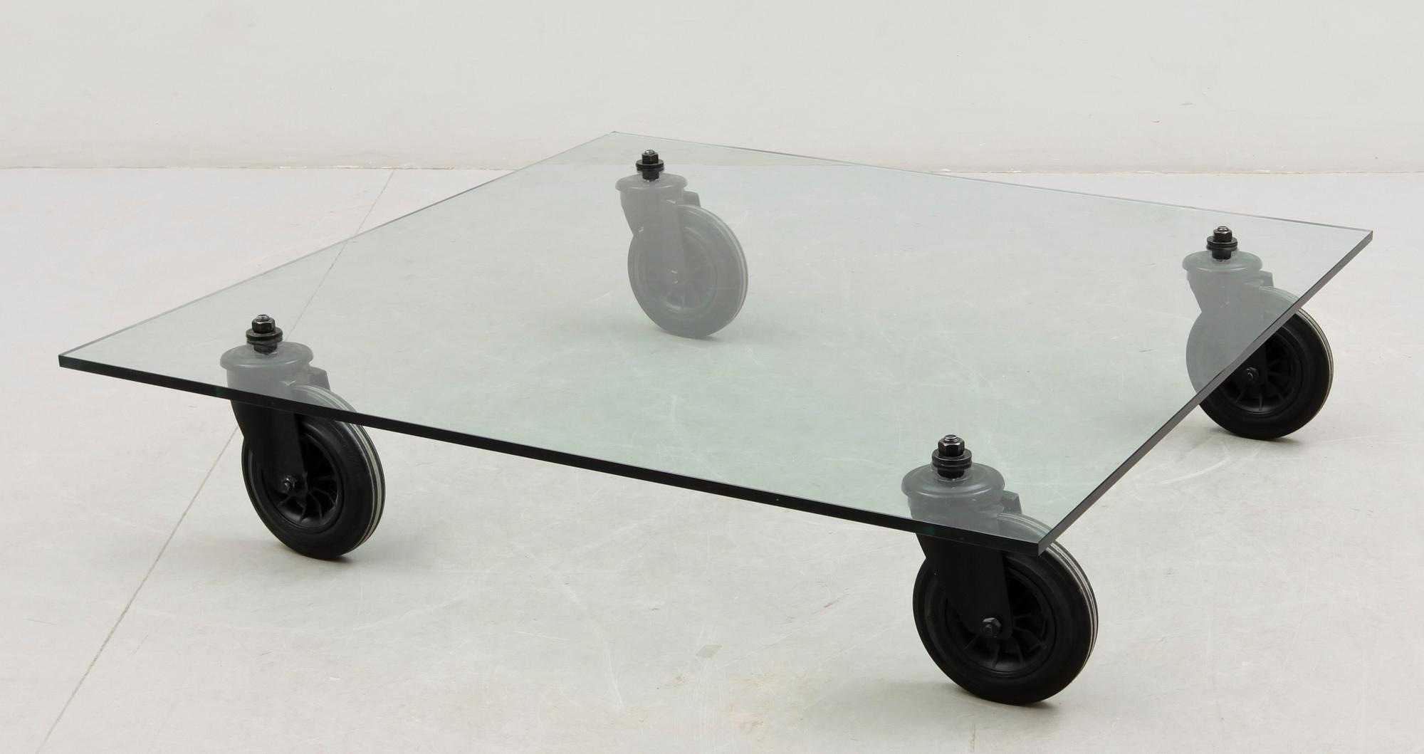 A Gae Aulenti 'Tavola con Ruote' table, Fontana Arte, Italy.
