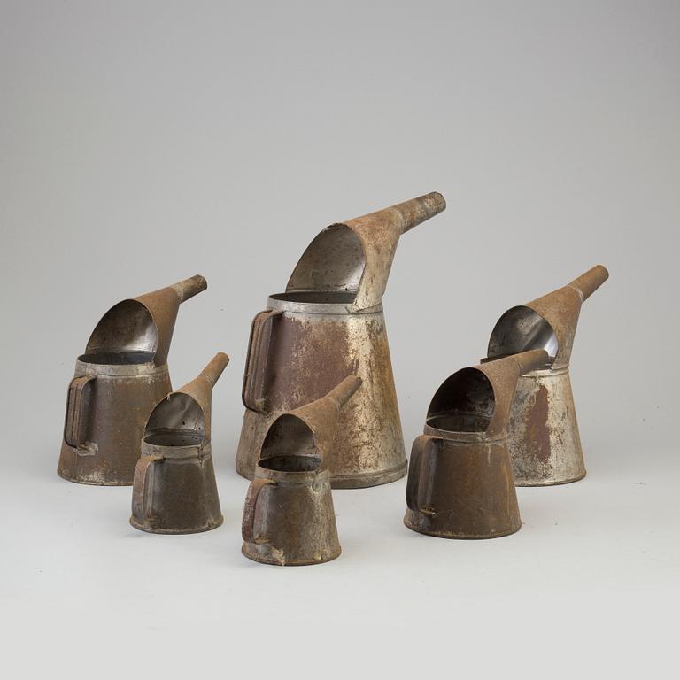 Six tin oil jugs, first half of the 20th Century.
