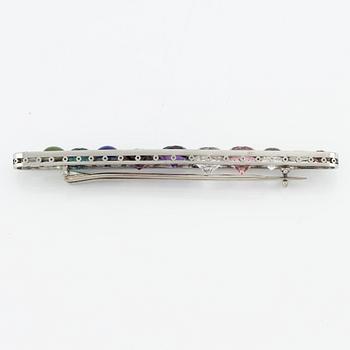 Brooch, platinum with gemstones and diamonds.