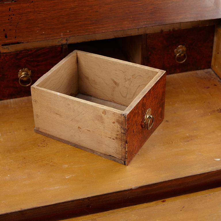 A Swedish late Baroque alder-veneered 'knee-hole' writing desk, first part of the 18th century.