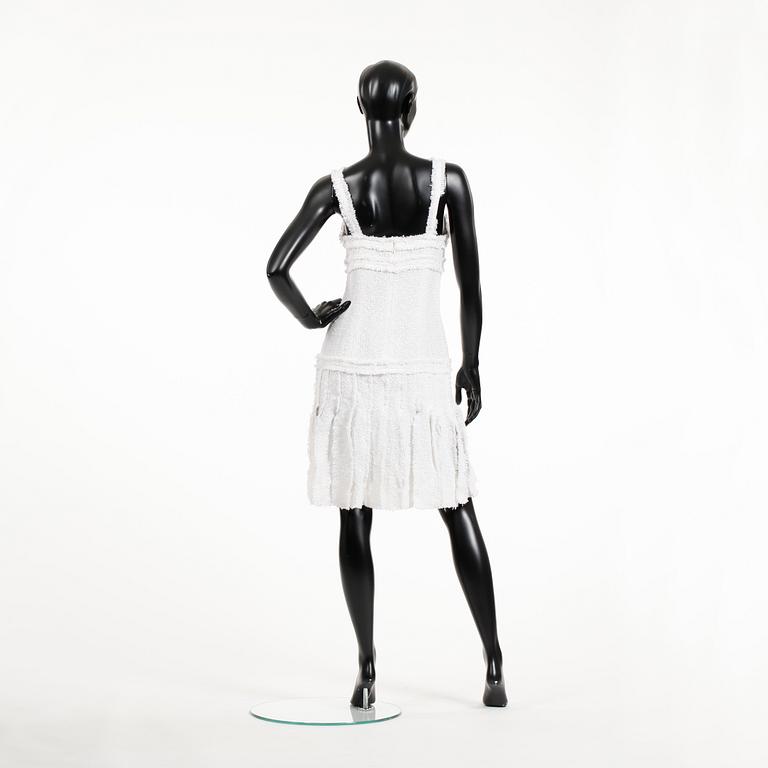 CHANEL, a white bouclé dress, 2004.