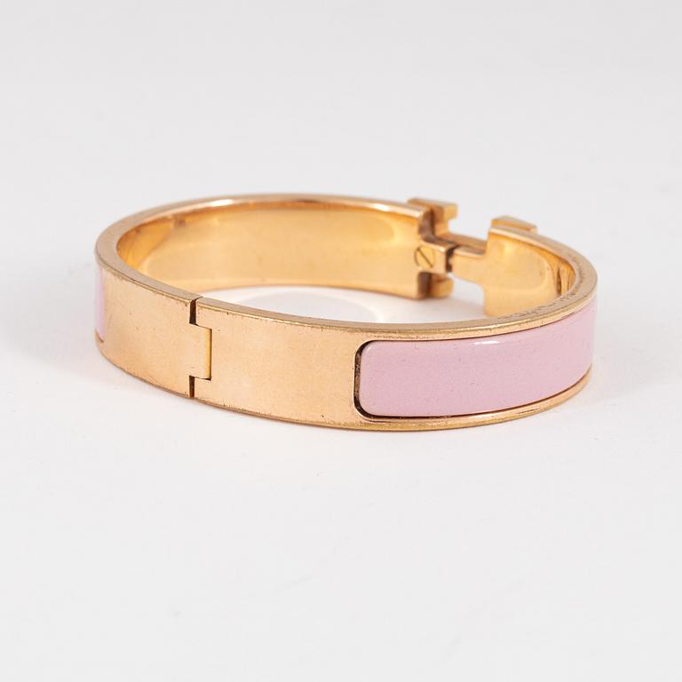 Hermès, a 'Clic H PM' bracelet.