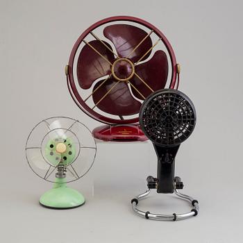 a set of three plastic and bakelite fans, mid 20th century.