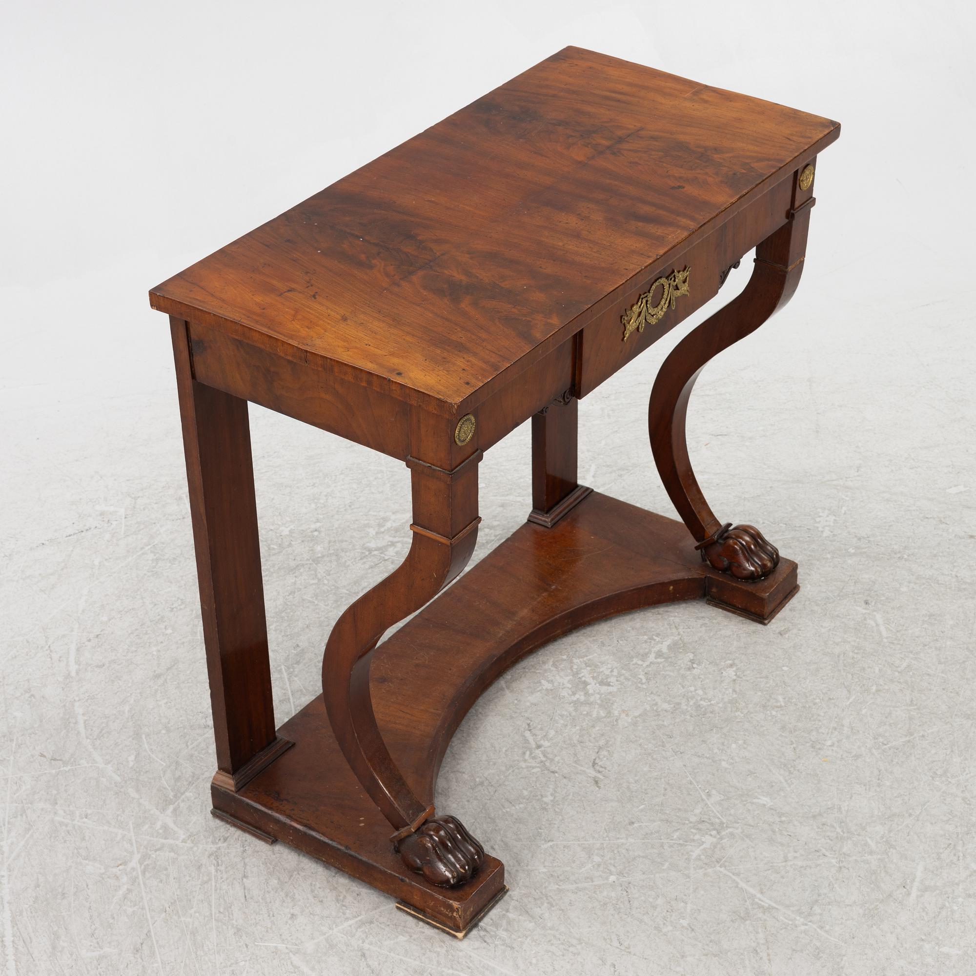 An empire console table, firts half of the 19th century.