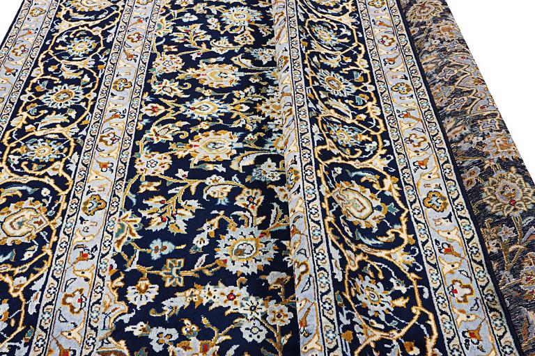 A Kashan carpet, c. 343 x 236 cm.