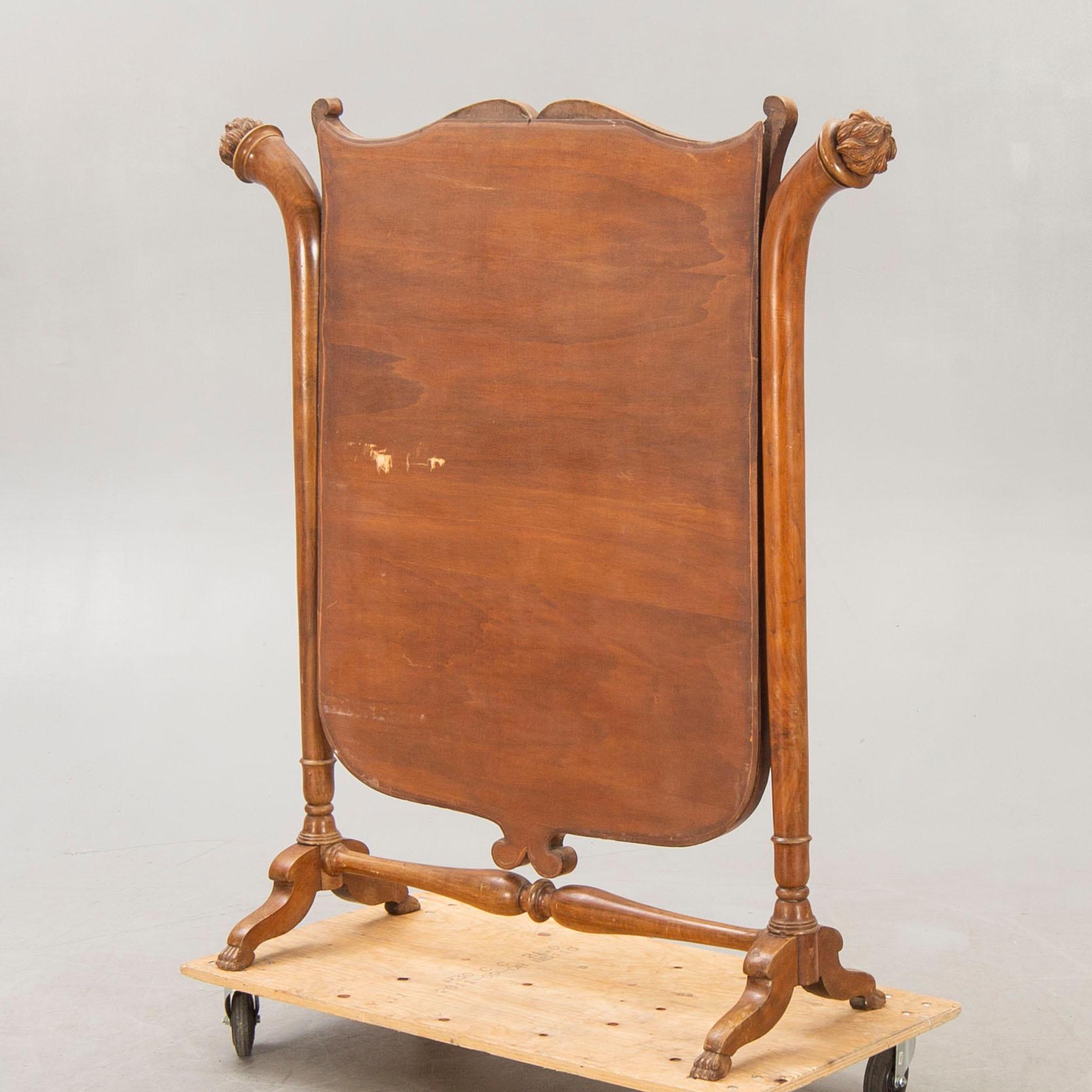 A late 19th century walnut floor mirror.