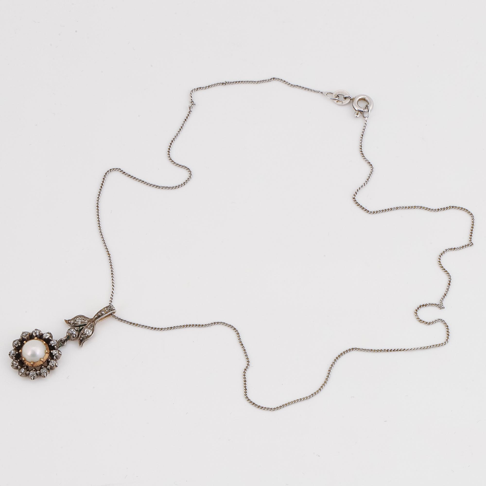 Old-cut diamond and pearl pendant.
