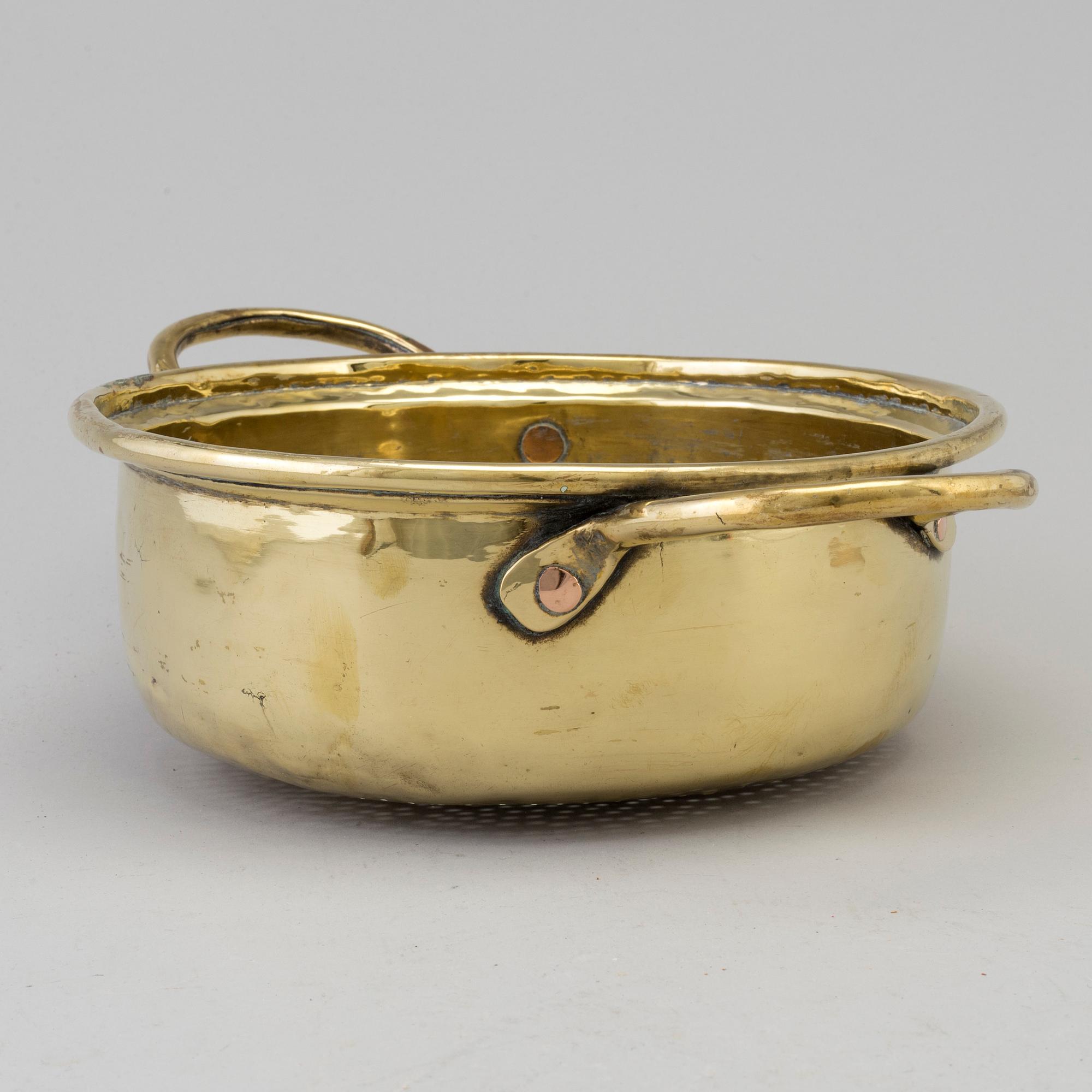 An 18th century brass colander.