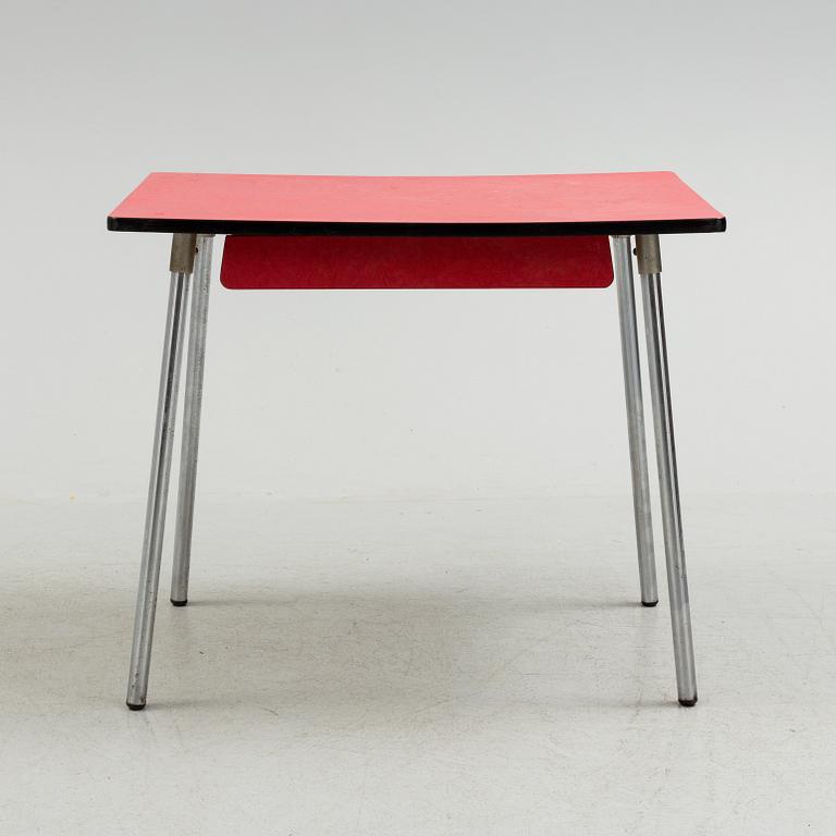 A mid 20th century table and chair.