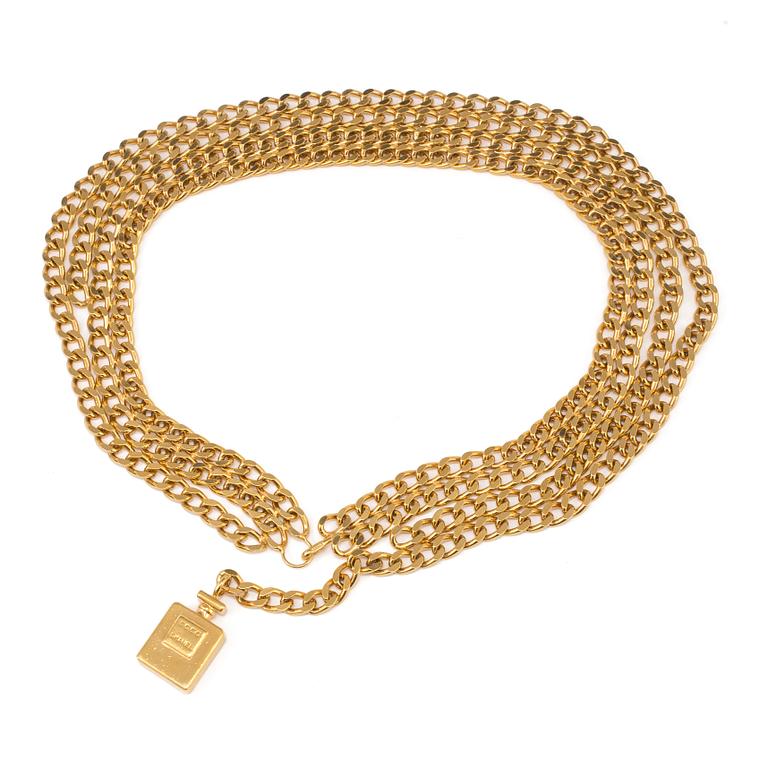 Golden belt, by Chanel.