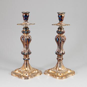 A pair of silver plated candlesticks.