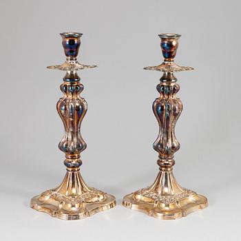 A pair of silver plated candlesticks.