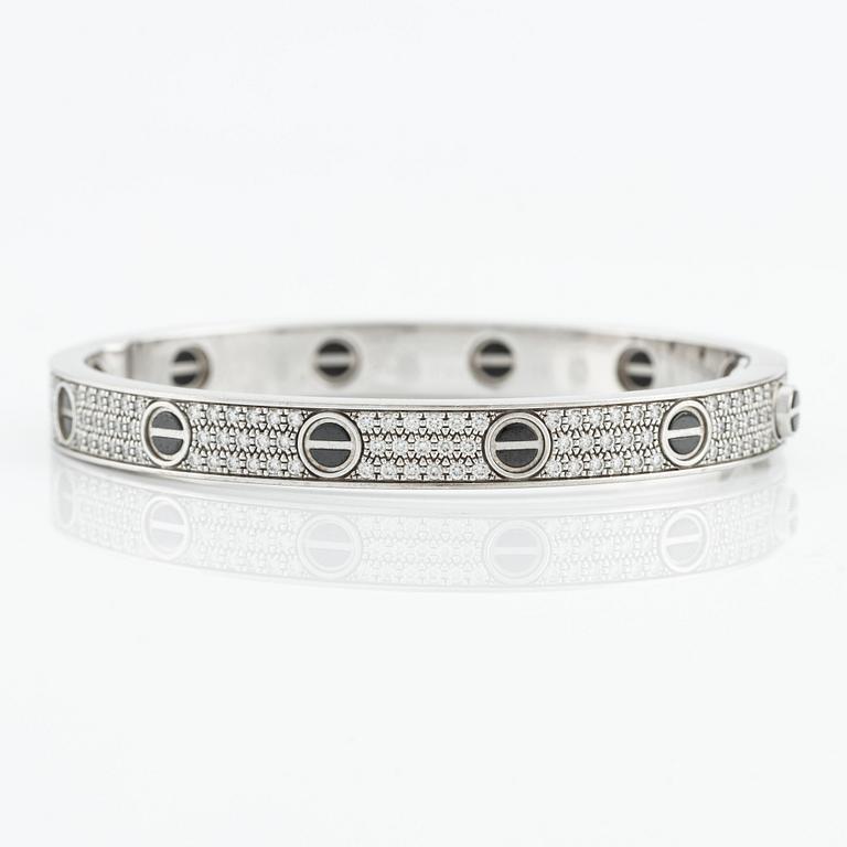 An 18K white gold Cartier bracelet "Love" with round brilliant-cut diamonds and ceramic.