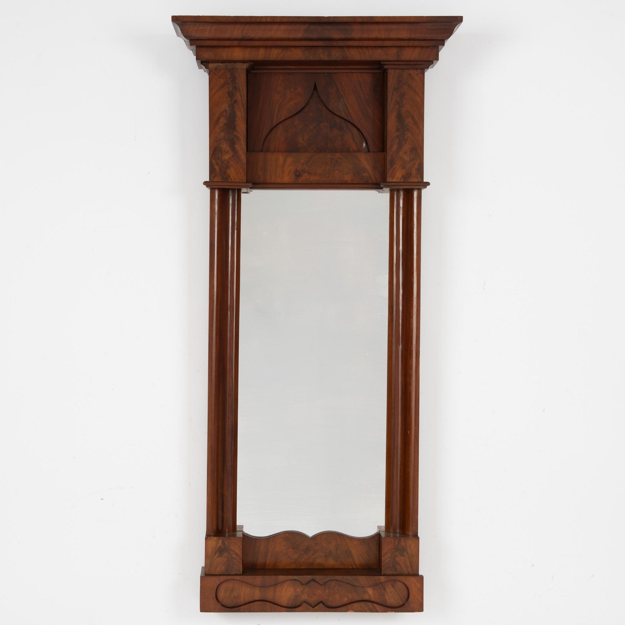 An Empire mirror, first half of the 20th Century.
