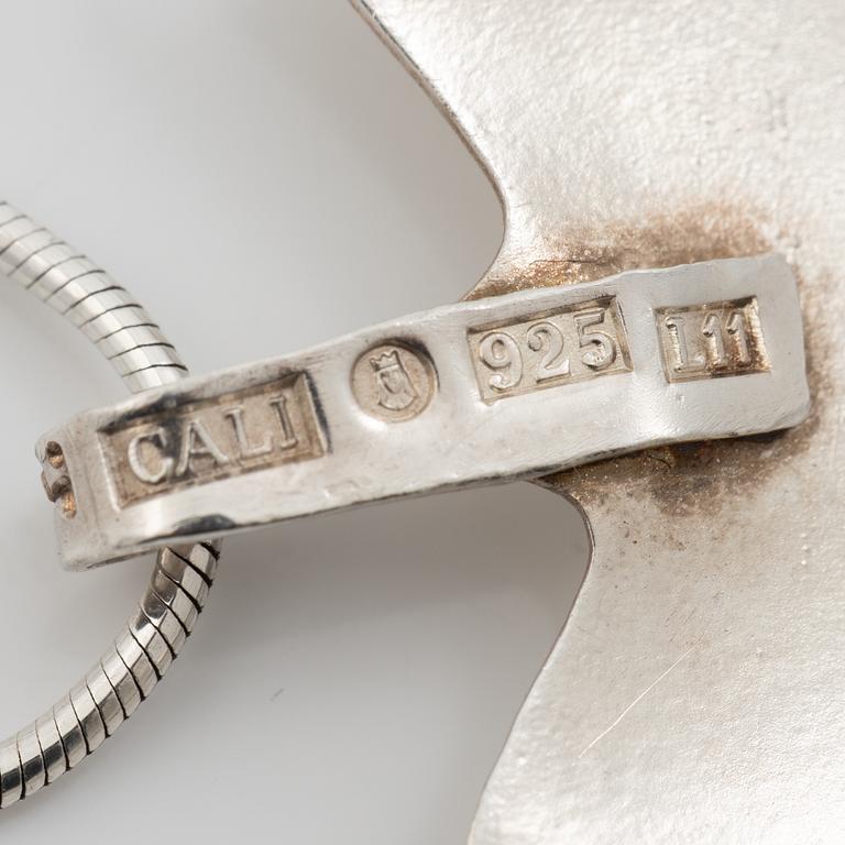 Caroline Lindholm, Pendant with chain, silver, in the form of maple leave.