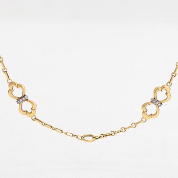 An 18K gold necklace, with diamonds totalling approx. 0.12 ct. Foreign hallmarks.