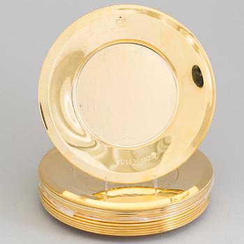 12 brass plates by Skultuna.